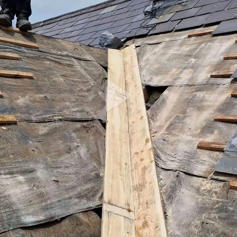 New timber boards fitted along a roof valley between the adjoining roof slopes